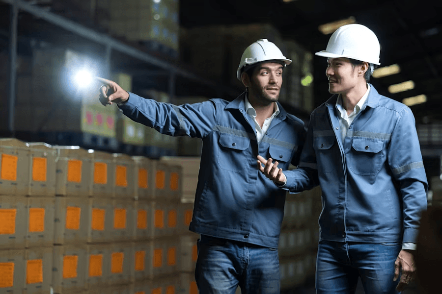 Engineers in hard hats reviewing a site