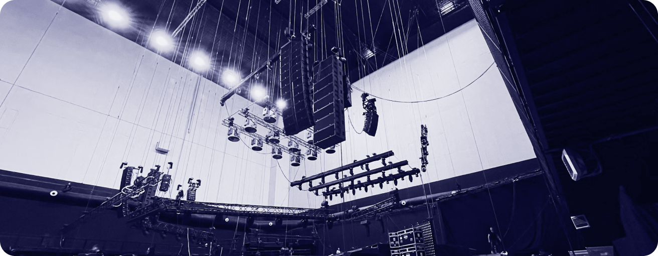 Event rigging equipment with lighting and speaker arrays in a venue
